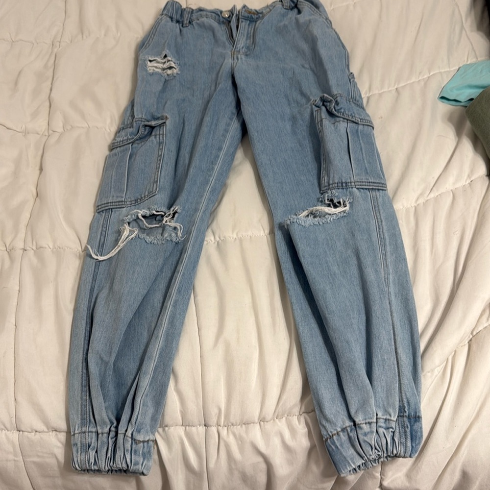 Forever 21 blue jeans with cuffed bottoms.